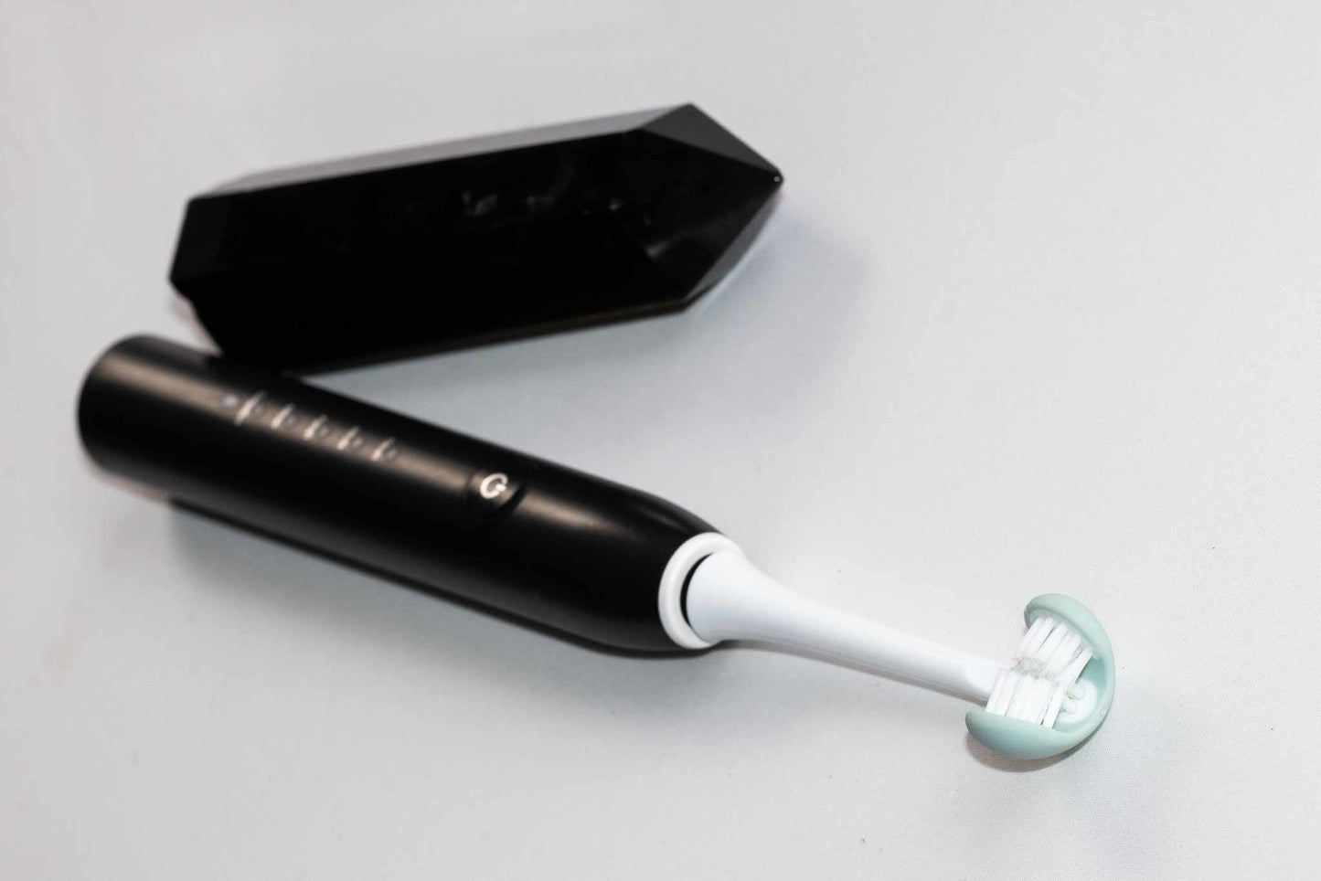 Water-resistant adult electric toothbrush on a bathroom counter