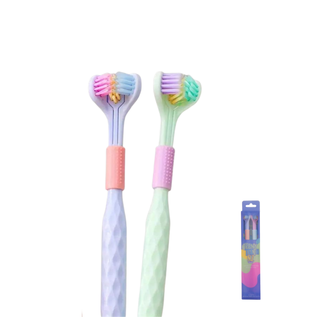 Pair of adult toothbrushes from Trio Teeth NZ with soft bristles and ergonomic handles for effective oral cleaning.