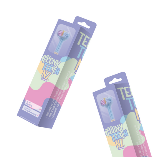 Two Trio Teeth NZ teens' toothbrushes with colorful handles, designed for kids' oral hygiene.