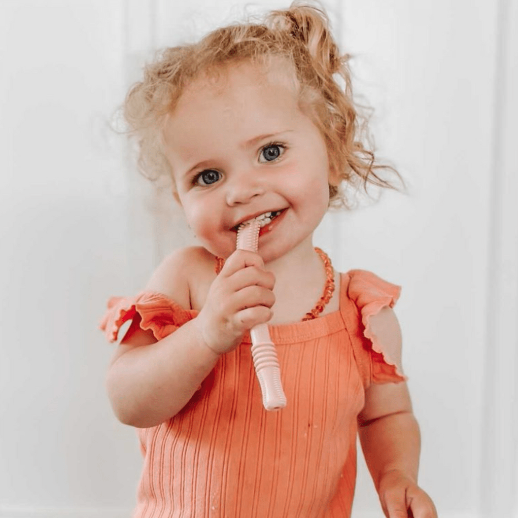 Four food-grade silicone teething tubes by Teeny Teeth NZ, designed for soothing babies during teething.