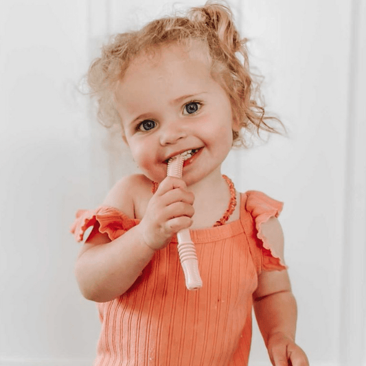 Four food-grade silicone teething tubes by Teeny Teeth NZ, designed for soothing babies during teething.