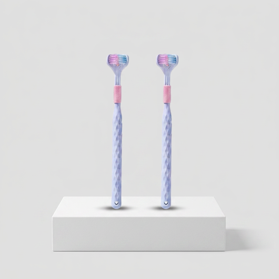 Pair of adult toothbrushes from Trio Teeth NZ, featuring ergonomic handles and soft bristles for effective oral cleaning.