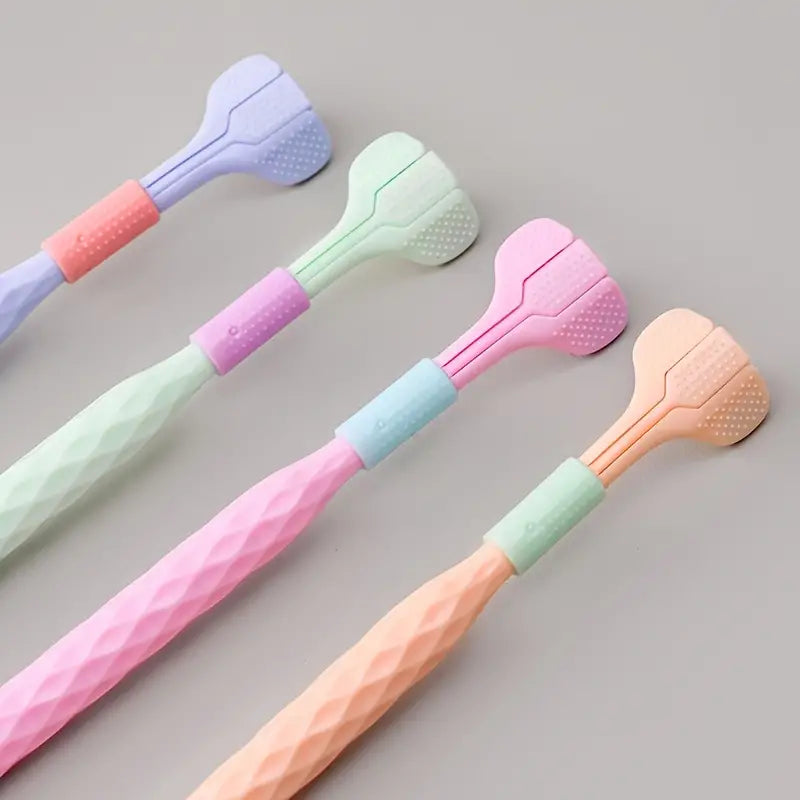 Two adult toothbrushes from Trio Teeth NZ in a diamond-shaped back view, showcasing the bristle design and ergonomic handles.